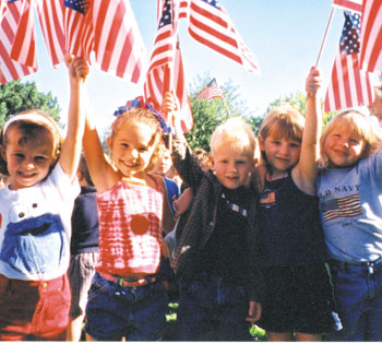 Rae Chambers, Lauren Conley, Sam Marley, Tiffani Strain, and Paige Criddle, kingergartners in Ms. Ferguson's class at Sandburg Elementary, participate in a Day of Remembrance ceremony held on Friday, September 14